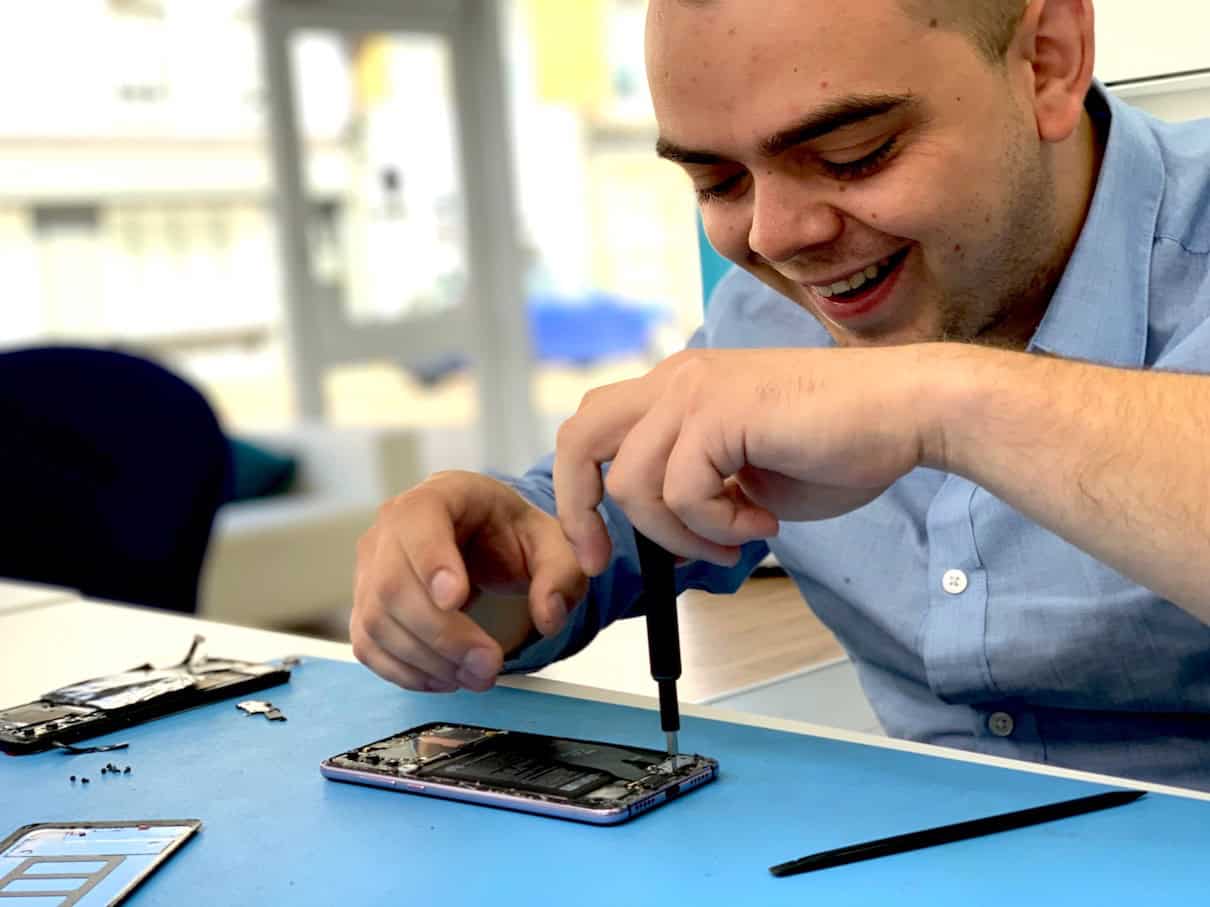 Fixfactor technician repairing a phone in London workshop
